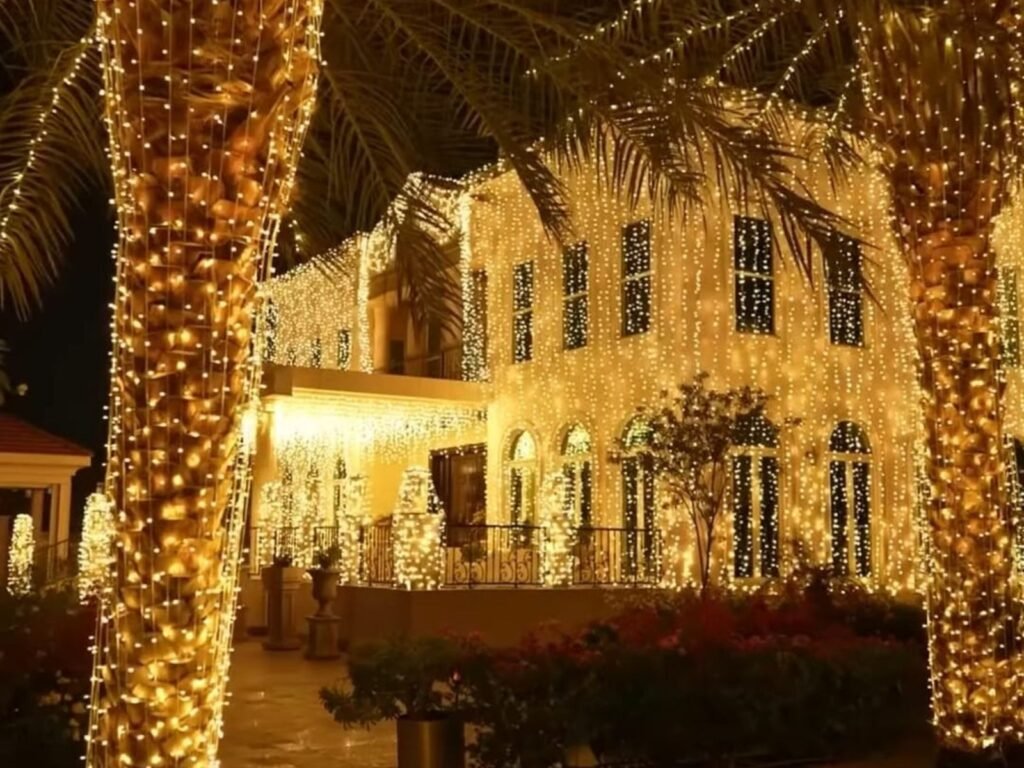 elegant outdoor wedding lighting setup in qatar featuring palm trees and villa wrapped in warm white led string light