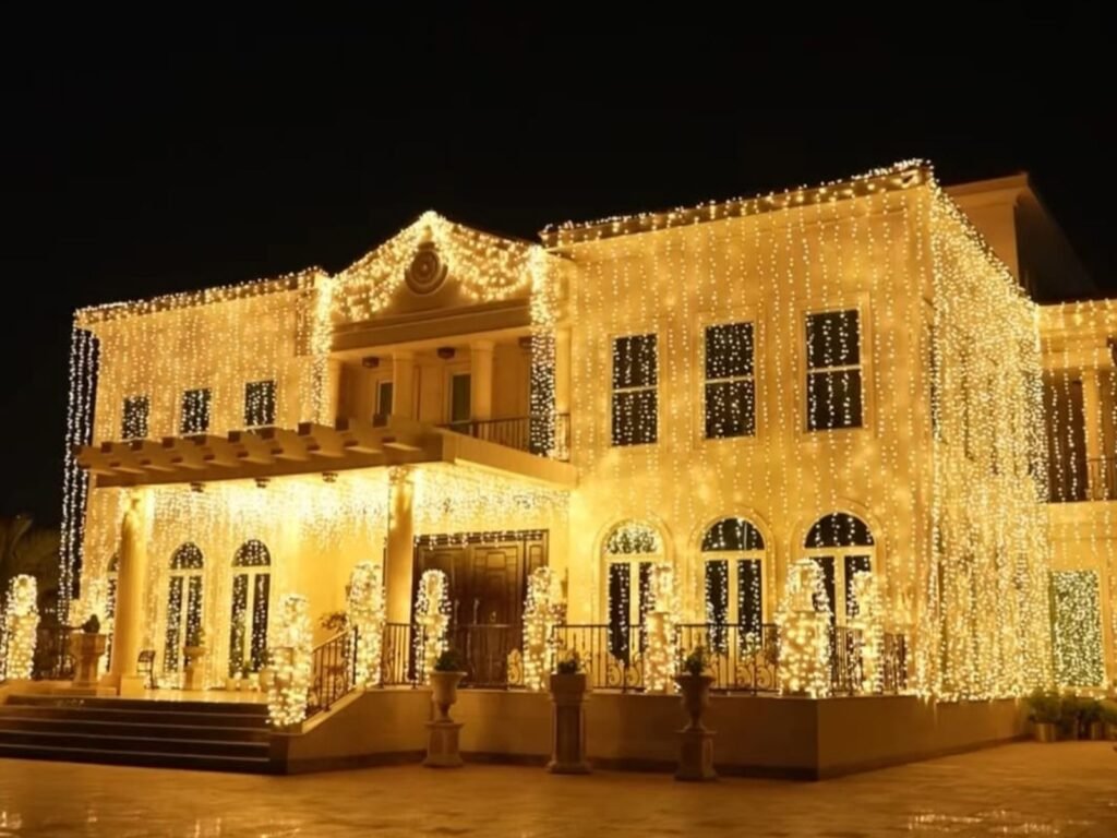 premium wedding house lighting design in qatar showcasing full exterior illumination with cascading warm lights for a special event