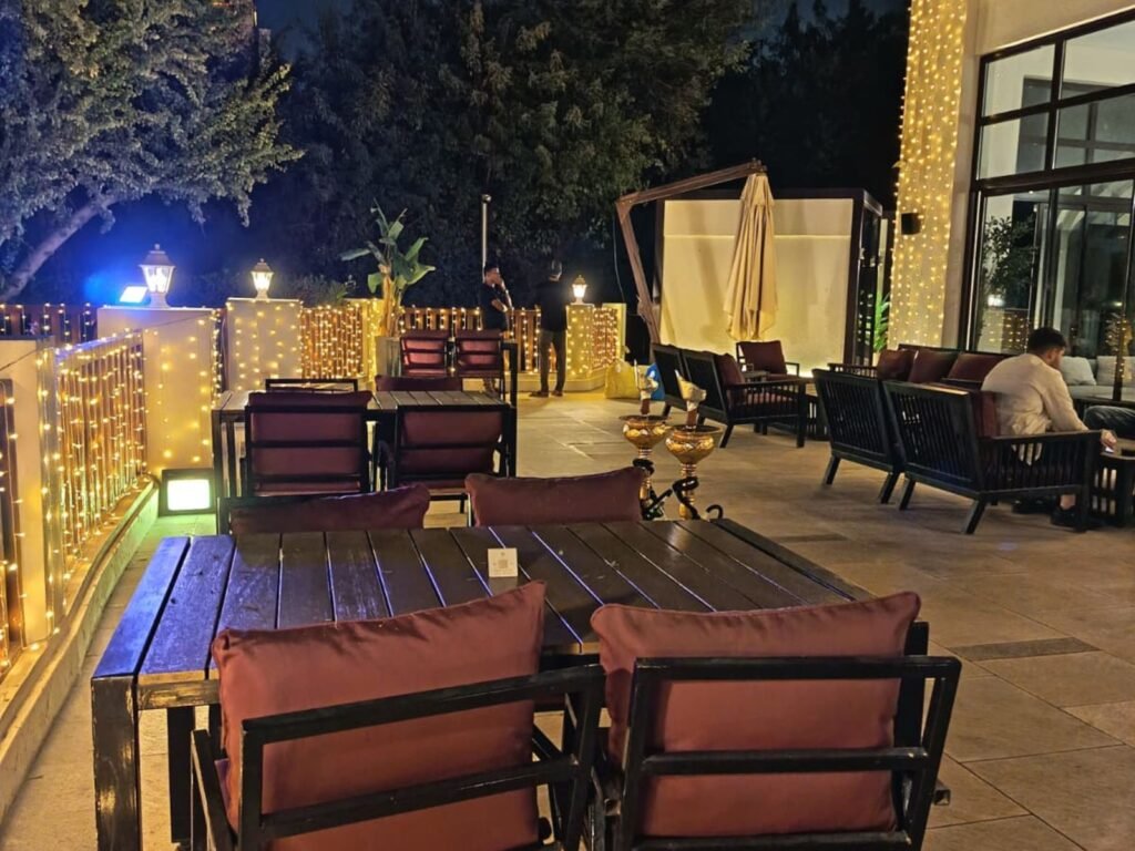 premium outdoor event lighting setup with overhead string lights creating a canopy effect