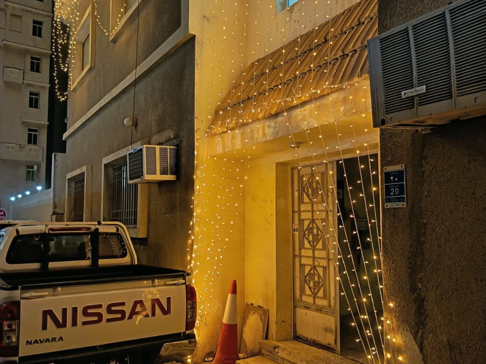 Home villa entrance decorated with curtain fairy lights on al mulaikha street creating an elegant wedding atmosphere.